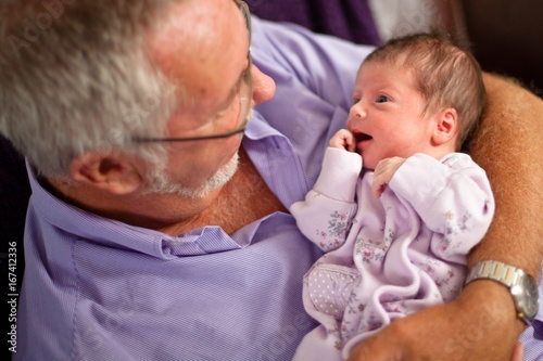 Fotografie Happy cute smiling  little kid with grandpa