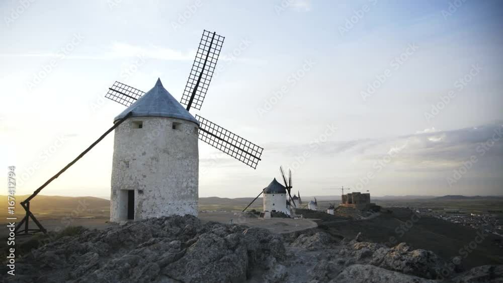Panoramic view of Consuegra, Toledo province, Castilla la Mancha, Spain. Old windmills and a castle in the background. Locked down real time medium shot