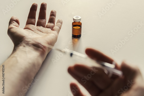 Self injecting from a medicine vial 