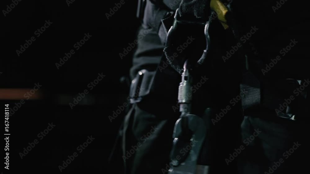 Female connect the hooks with equipment on her clothes Female connect the hooks with equipment on her clothes