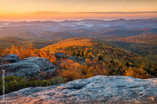 Scenic sunrise over fall foliage, Blue Ridge Mountains, North Carolina.