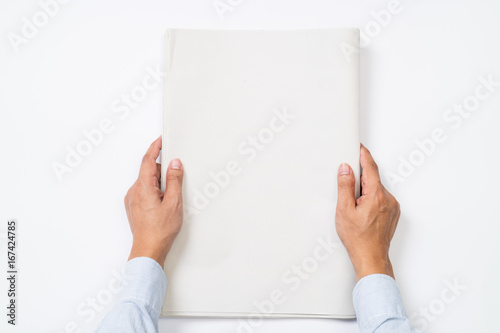 Businessman is holding blank newspapers on isolated background.