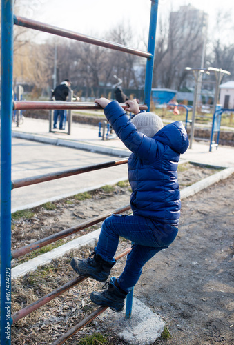 Boy on the simulators in the park © schankz