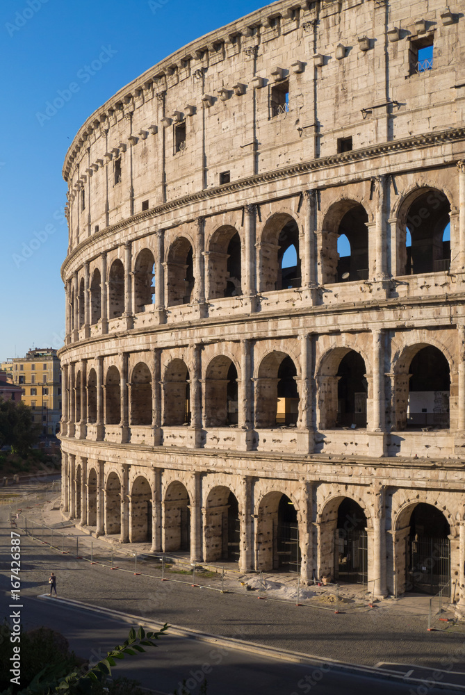 Rome, Italy - The archeological ruins with Colosseum in historic center of Rome, named Imperial Fora, in a sunday morning.