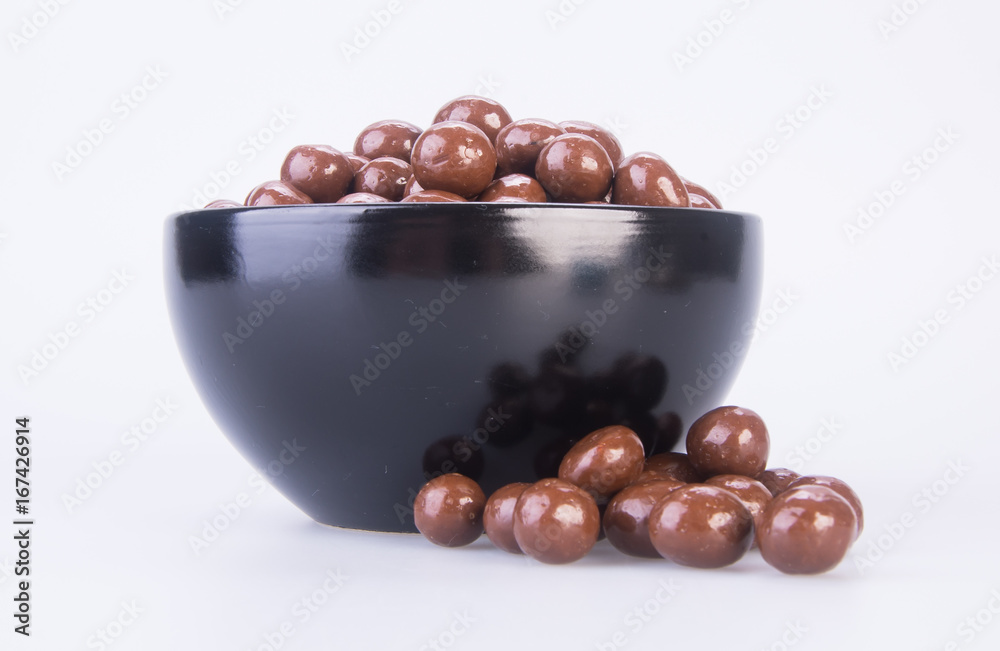 Obraz premium chocolate balls. chocolate balls in bowl on a background