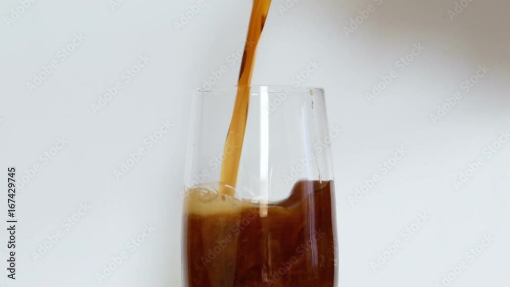 Pouring a Glass of dark Beer on white background. Full HD video Pouring a Glass of dark Beer on white background. Full HD video