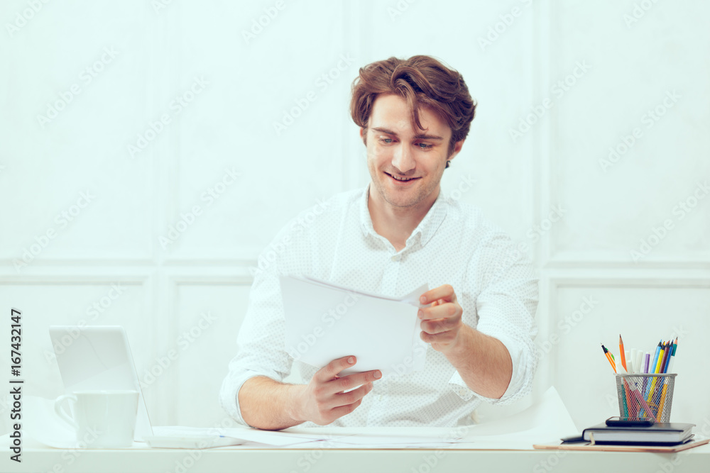 Businessman using laptop with tablet and pen Businessman using laptop with tablet and pen