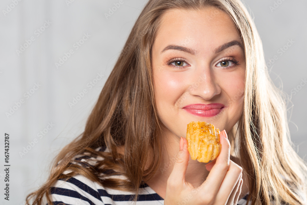 Beautiful smiling young woman with a cake
