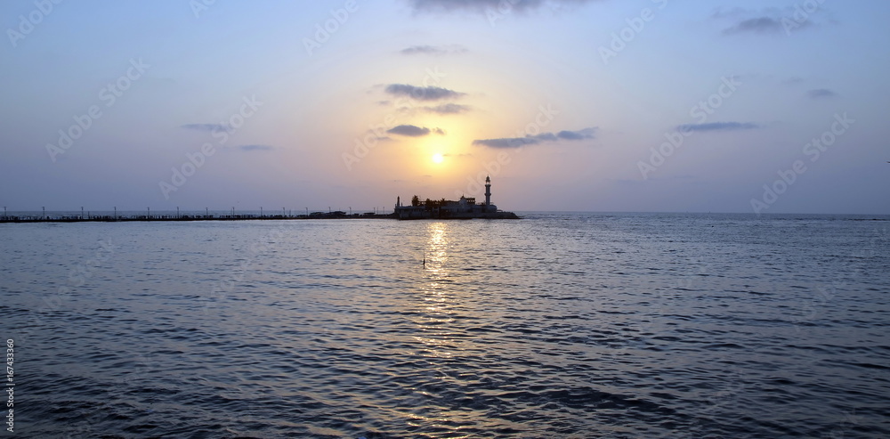 Mosque Haji Ali in Mumbai at sunset; Mosque was built in 1431 in memory of a rich Muslim merchant 