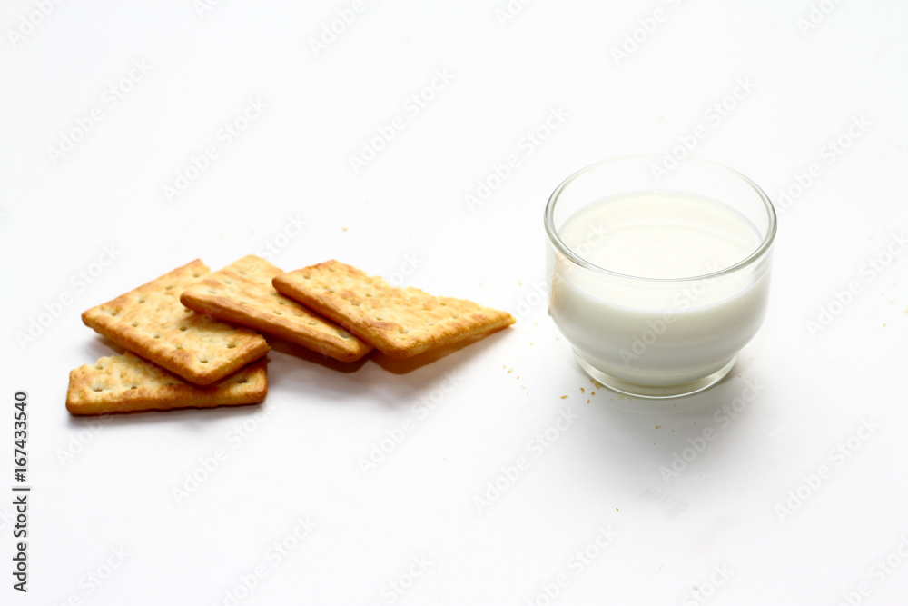 A cracker is a baked food typically made from flour. Flavorings or seasonings, such as salt, herbs, seeds, and/or cheese, may be added to the dough or sprinkled on top before baking A cracker is a baked food typically made from flour. Flavorings or seasonings, such as salt, herbs, seeds, and/or cheese, may be added to the dough or sprinkled on top before baking