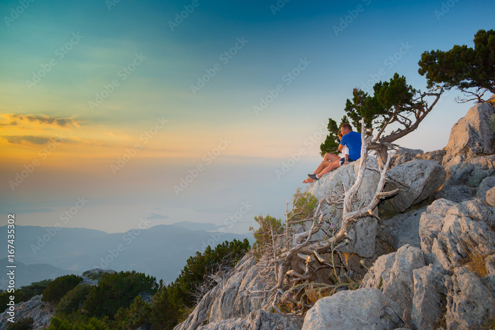 Сouple admiring the sunset on mount Babadag