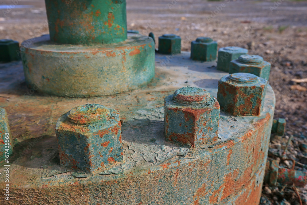 The bolts and nuts on the industrial equipment The bolts and nuts on the industrial equipment