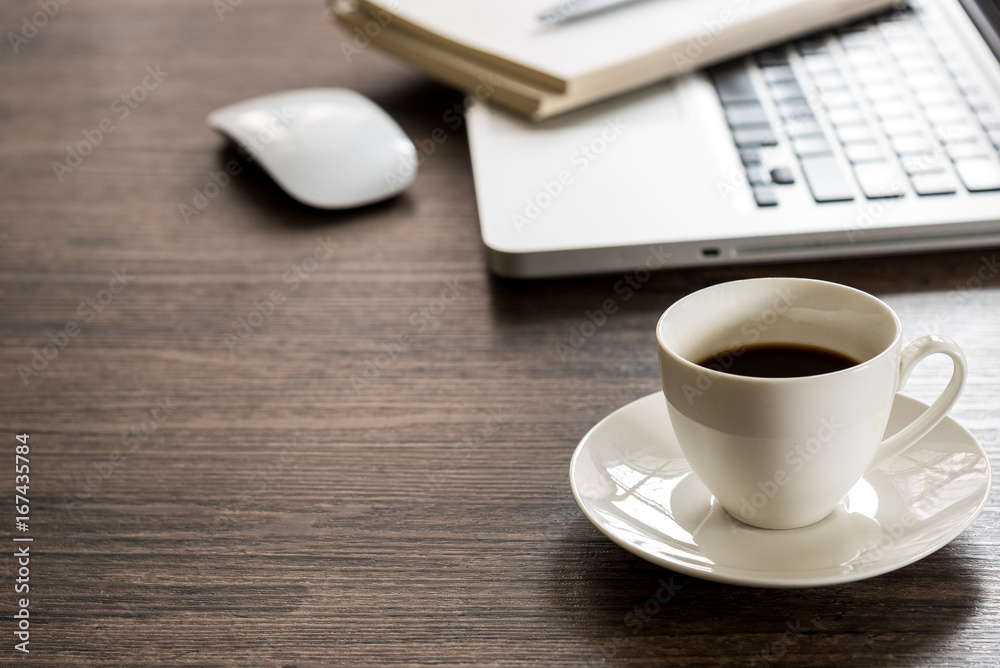 Black coffee on the office desk table with computer, silver pen. Business desk table top view with copy space concept. Black coffee on the office desk table with computer, silver pen. Business desk table top view with copy space concept.