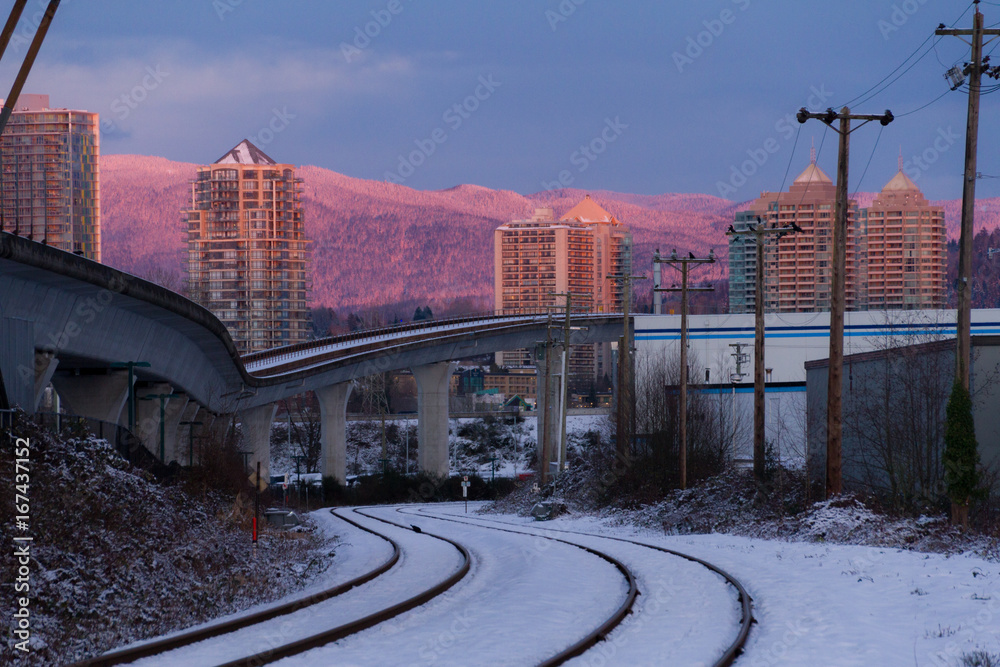 Empty rail in city while colorful sunset in winter