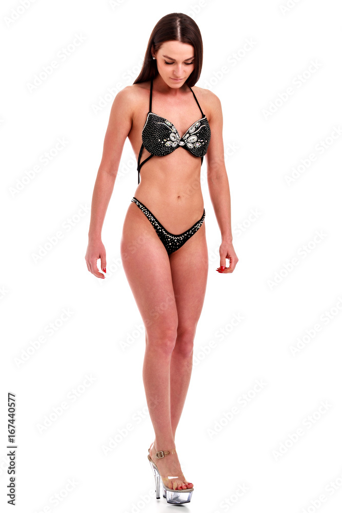 Young beautiful athletic girl with sexy body in bikini. Isolated on white background. Young beautiful athletic girl with sexy body in bikini. Isolated on white background.