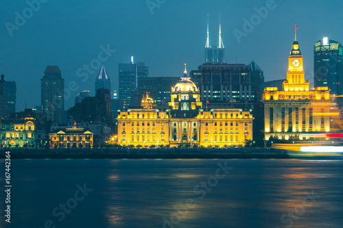 There are Shanghai Banking Corporation Building (HSBC) on left and the Customs House on right. photo