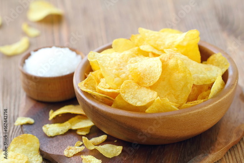 Potato chips in bowl. Fast food.