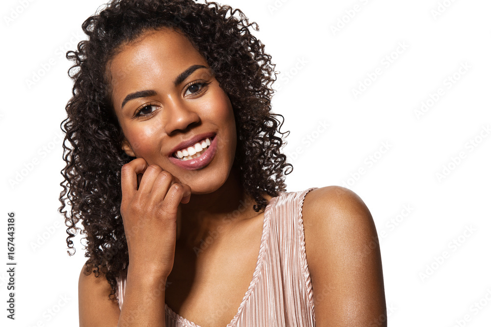 Beautiful black smiling woman with clean skin, natural make-up, and white teeth on white background Beautiful black smiling woman with clean skin, natural make-up, and white teeth on white background