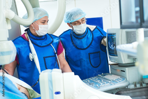 andiography and ultrasound surgeon at surgery operating room photo