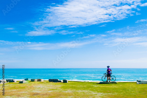 Cyclist and Bicycle on Chishintan Beach, Hualien, Taiwan.