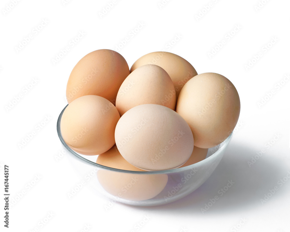 Fresh chicken eggs in a bowl, with shade on white background Fresh chicken eggs in a bowl, with shade on white background