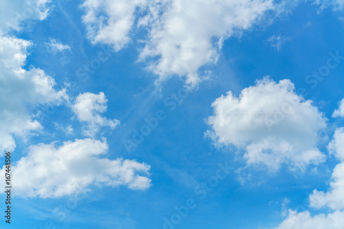 The vast bright blue sky and coulds  nature background.