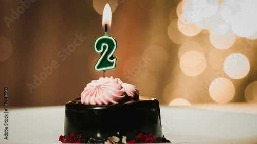 Birthday or anniversary candle on cake photo