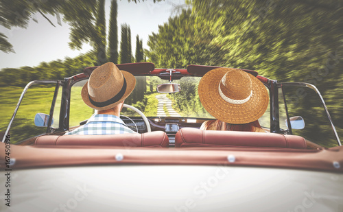 road in tuscany and two lovers in retro car  photo