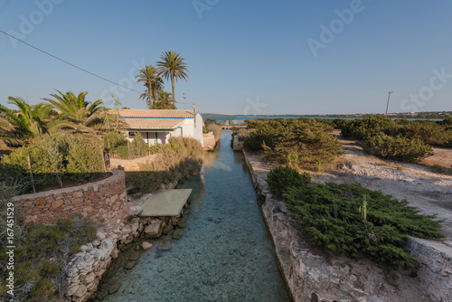 House on the aqueduct to the salt flats of the island of Formentera. Spain