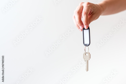 woman´s hand holding a key