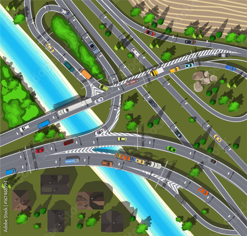 Top view highway next to a field and a river