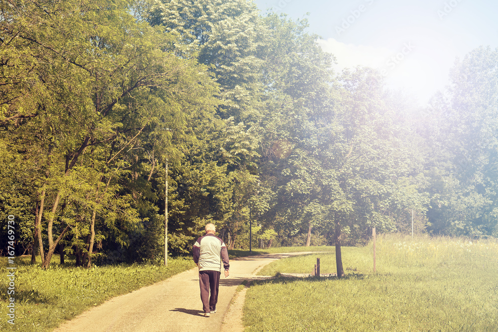 sportive senior at park, man walking to stay healthy sportive senior at park, man walking to stay healthy