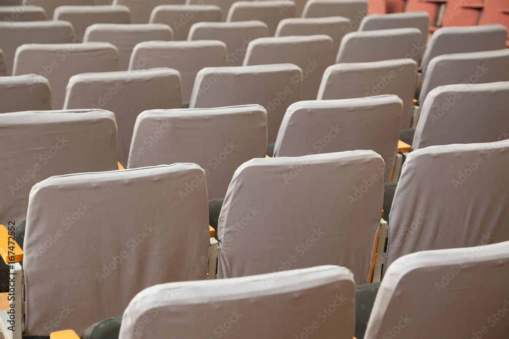 Naklejka premium Closeup of old grey seats in cinema