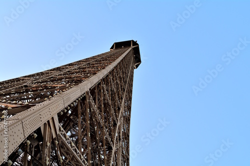 Detail of the top of the Eiffel tower view from the second floor.