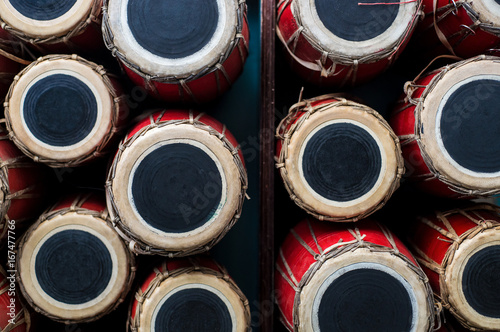 Nepali drums in a pile photo