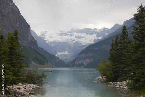 Canoeing on the beautiful emerald colored water of Lake Louise in Banff national park, Alberta, Canada. © Sonia