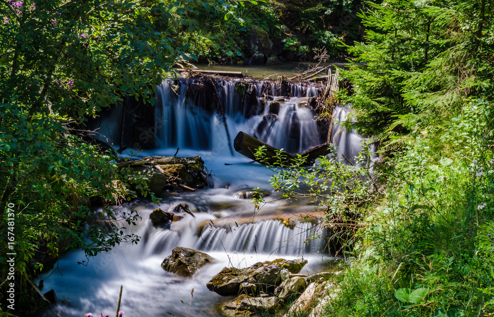 Obraz premium Landscape of waterfall Shypit in the Ukrainian Carpathian Mountains on the long exposure