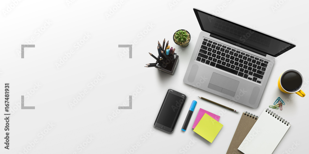 Office workplace with laptop, notebook, office supplies and stationery on white background. Solution, business planning, creative, design, learning, start up or working flat lay top view concept. Office workplace with laptop, notebook, office supplies and stationery on white background. Solution, business planning, creative, design, learning, start up or working flat lay top view concept.