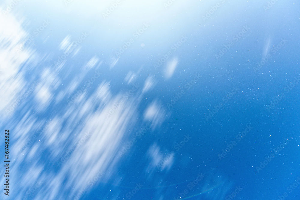Blue sky at night with stars and white clouds, long exposure Blue sky at night with stars and white clouds, long exposure