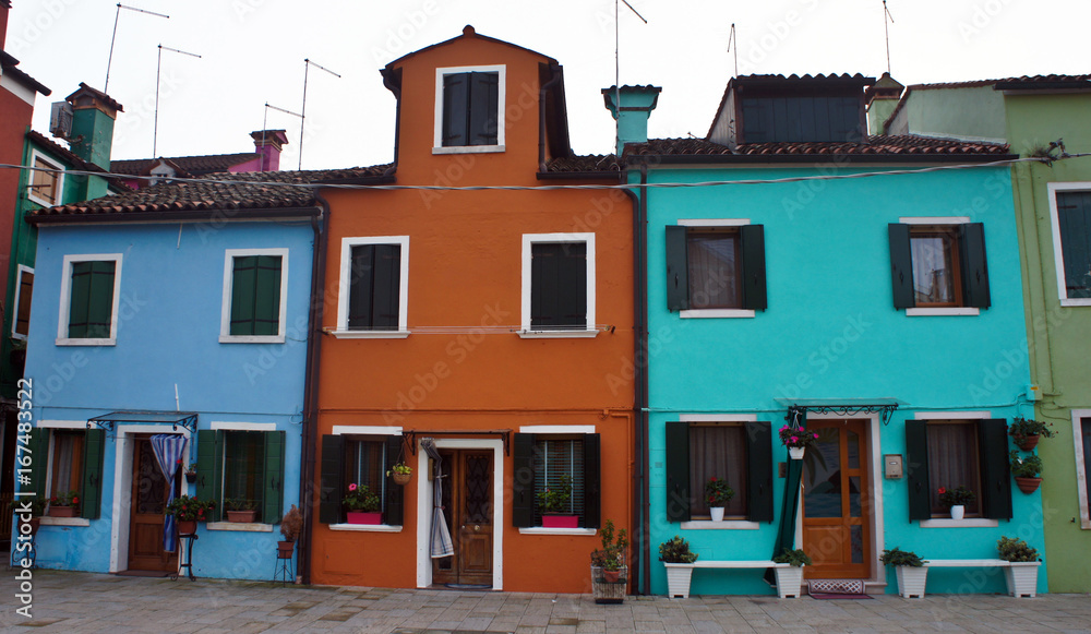 Colored facades of houses on the island of Burano near Venice, Italy Colored facades of houses on the island of Burano near Venice, Italy