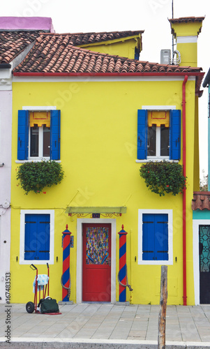 Beautiful yellow house on the island of Burano near Venice, Italy