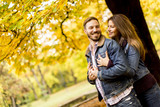 Young loving couple in the autumn park
