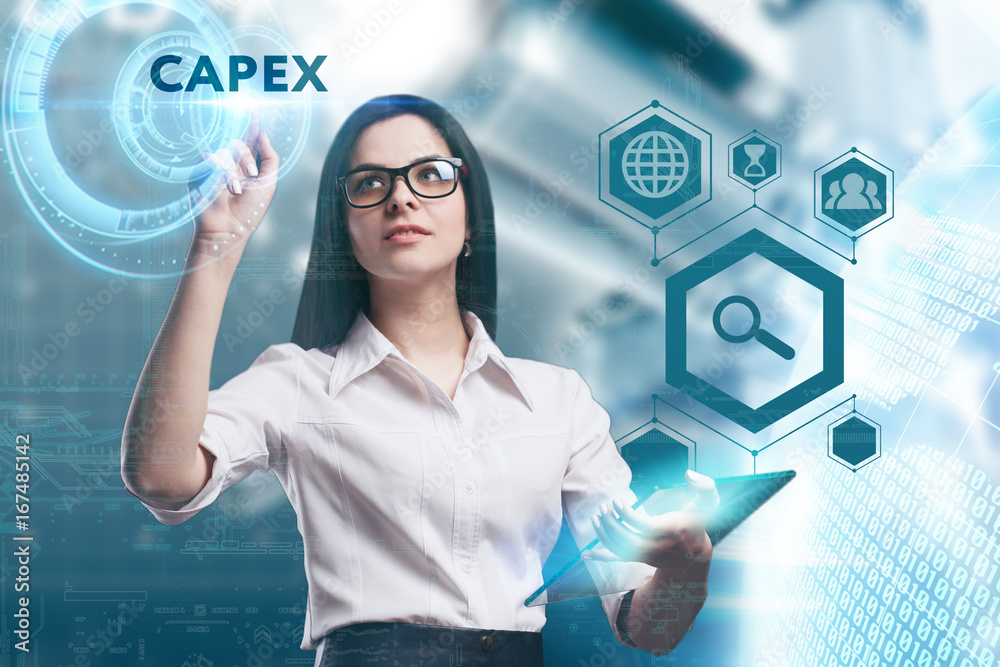 The concept of business, technology, the Internet and the network. A young entrepreneur working on a virtual screen of the future and sees the inscription: Capex The concept of business, technology, the Internet and the network. A young entrepreneur working on a virtual screen of the future and sees the inscription: Capex