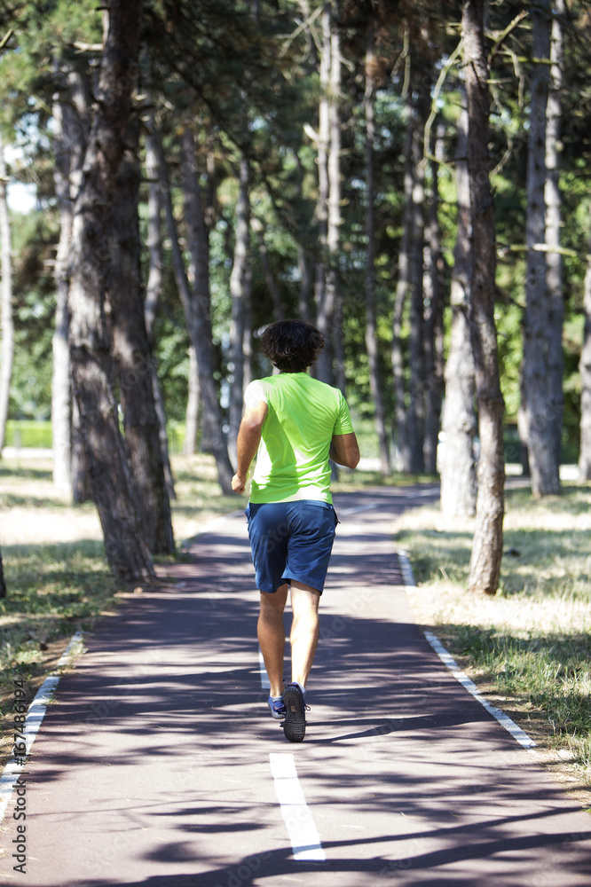Young man running in the park Young man running in the park