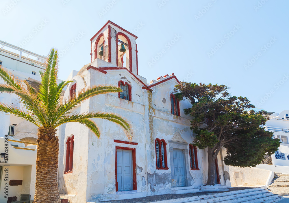 Courtyard of the St. Gerasimos Christian Church in famous Greek resort Fira, Santorini island, Greece, Europe.