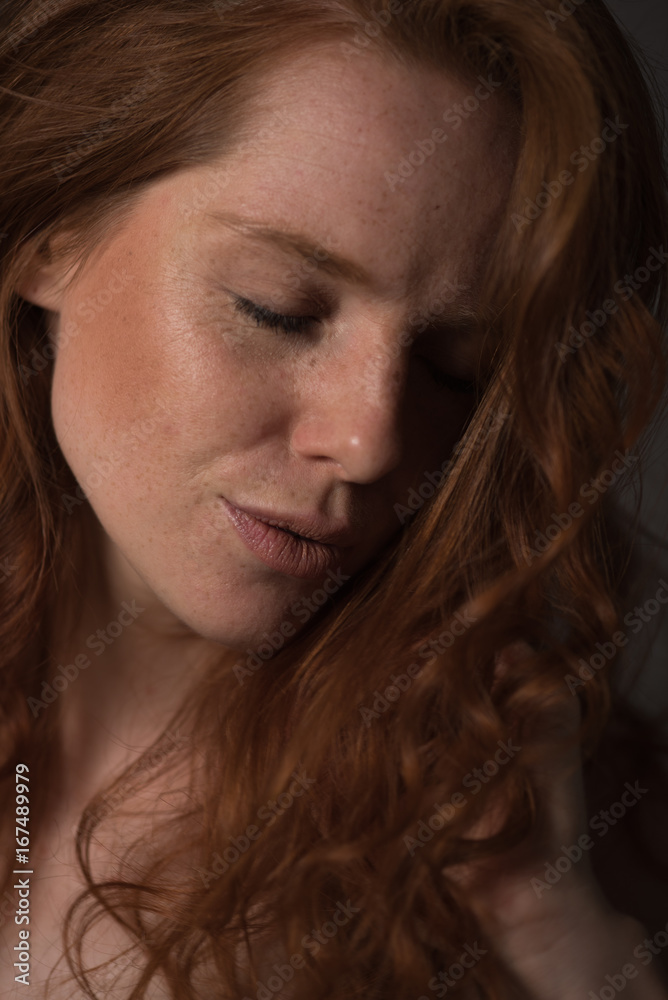 sensual portrait of a redheaded beautiful woman