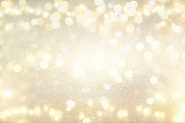 glitter vintage lights background. silver and light gold. de-focused