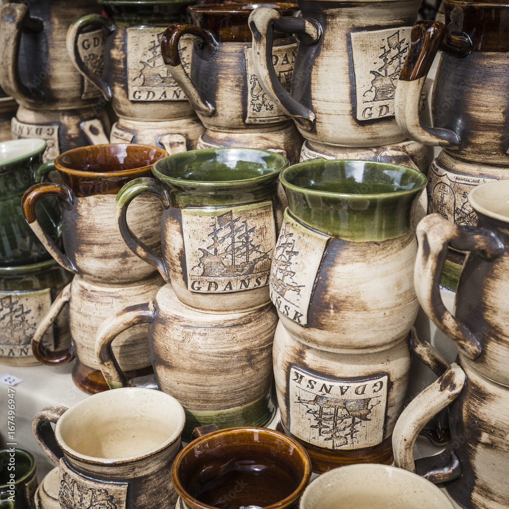 Artistic ceramic bowls as a souvenir at local traditional market in Poland.