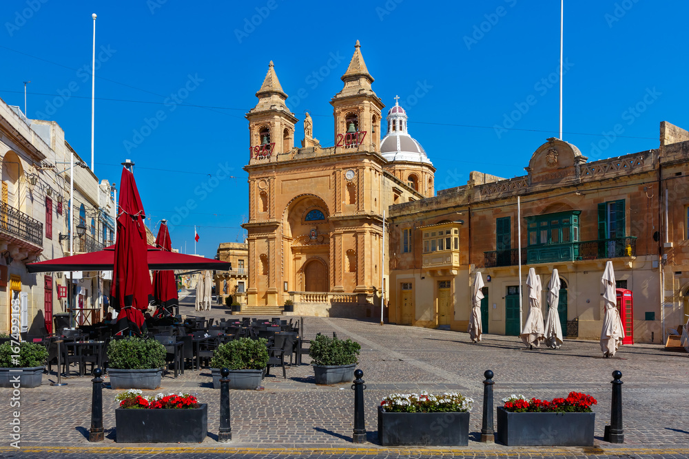 Parish Church of Our Lady of Pompei on main square of Mediterranean fishing village Marsaxlokk, Malta
