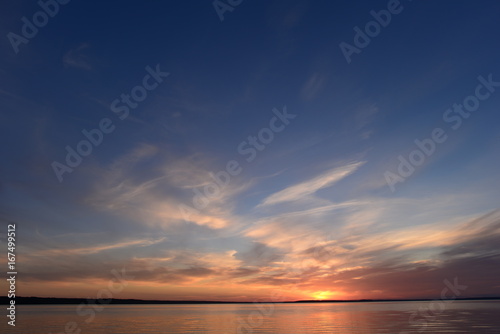 Fototapeta Naklejka Na Ścianę i Meble -  Glow of the sunset in a clear summer blue sky